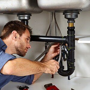 Plumber fixing drainage — septic services in Stuart, FL
