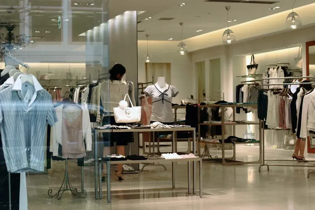 A woman is shopping in a clothing store.