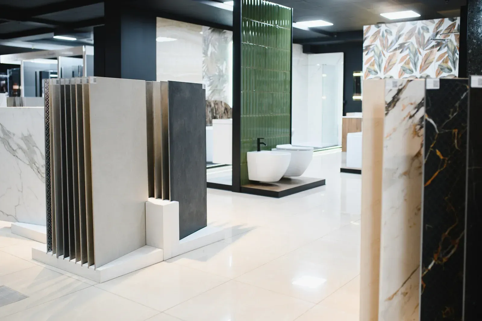 Tile showroom with various tile samples on display.