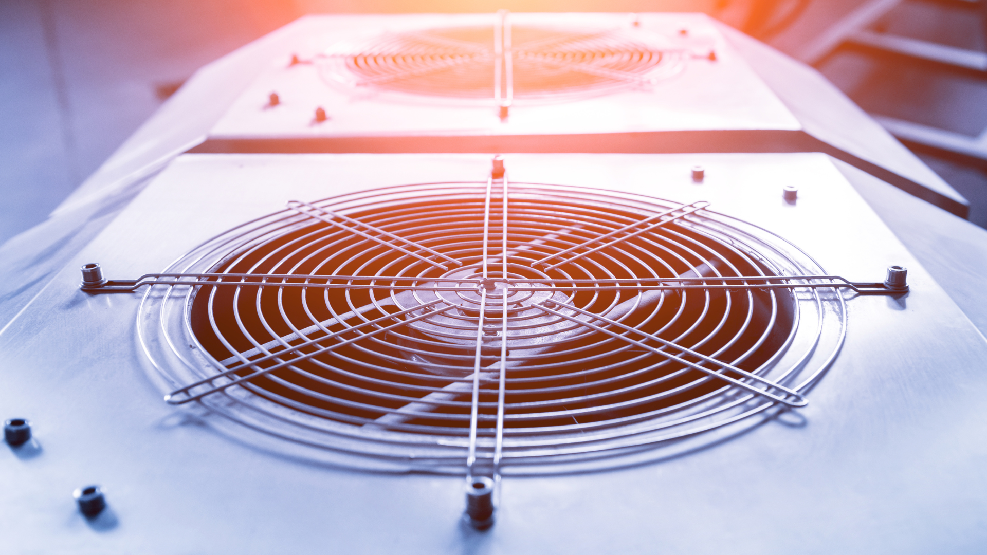 A close up of a fan on top of a machine.