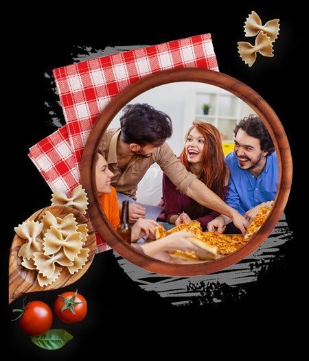 A group of people are sitting around a table eating pizza.