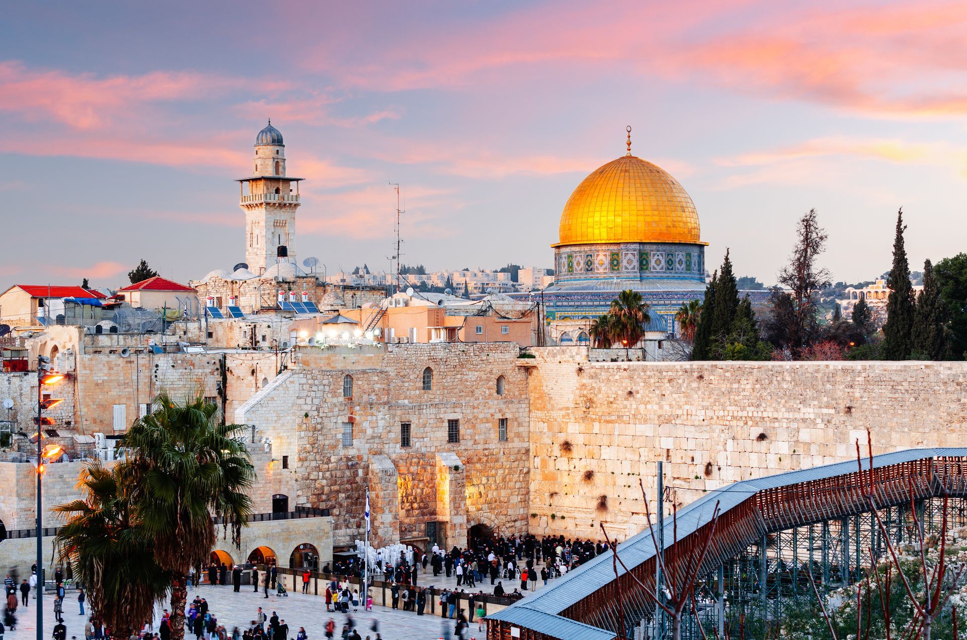 Jerusalem skyline with the Western Wall and Dome of the Rock at sunset.