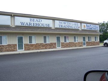 a building with a sign that says bead warehouse