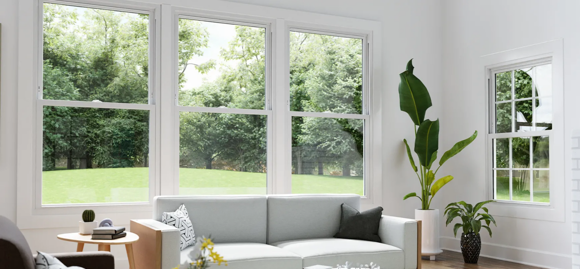 A living room with a couch , chair , and window.