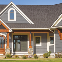A gray and white house with a gray roof