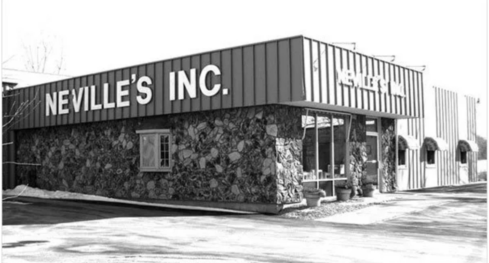 A black and white photo of neville 's inc.