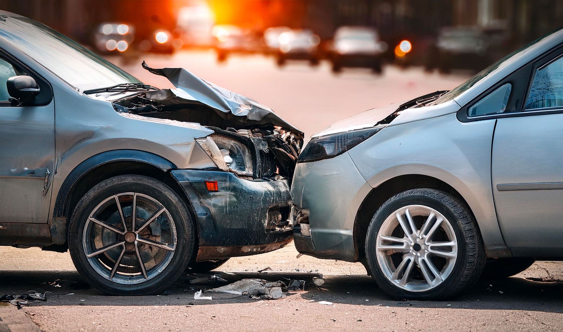 Two cars are involved in a car accident on a city street.