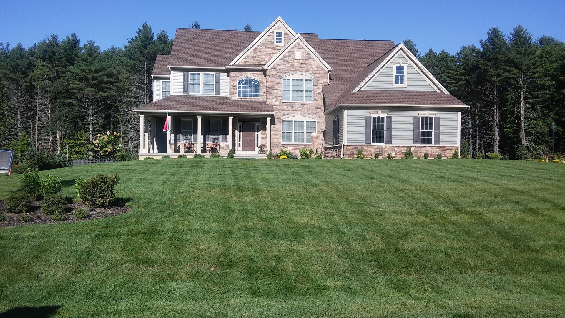 groomed lawn in front of home