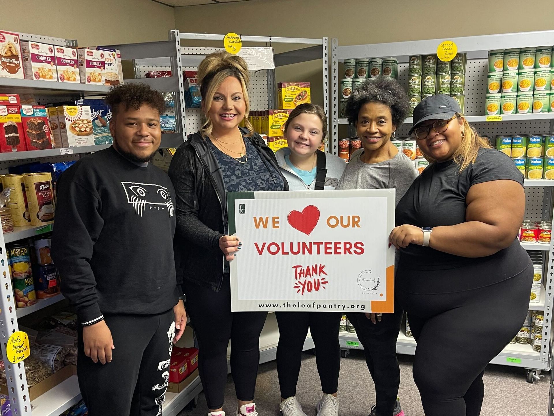 HRlogics' Birmingham, Alabama, office gives back to the Leaf Food Pantry — HRlogics' team holding a thank you sign with the Leaf Food volunteers.