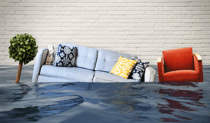 A couch and chair are floating in a flooded living room.