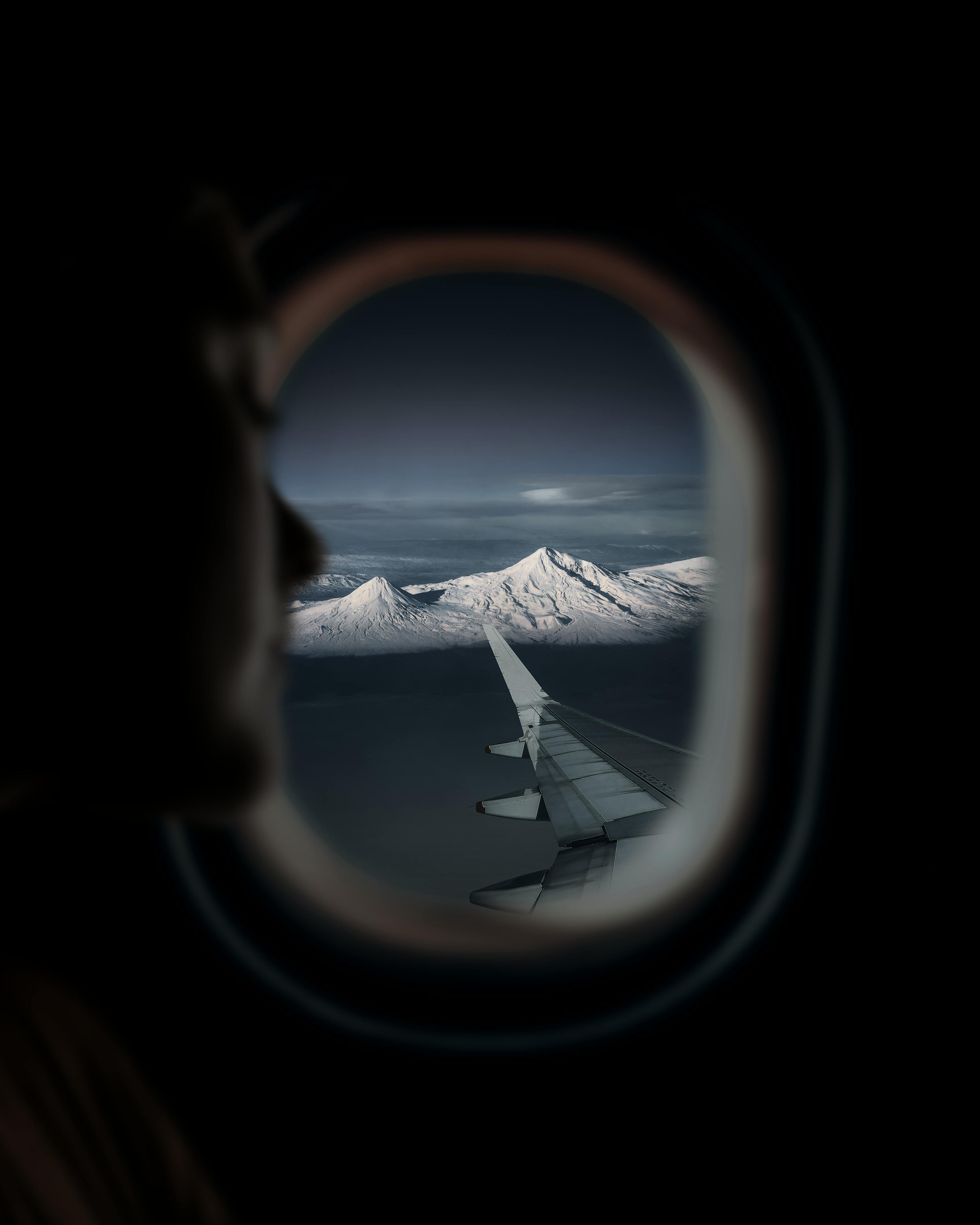 Mountain outside of an Airplane window