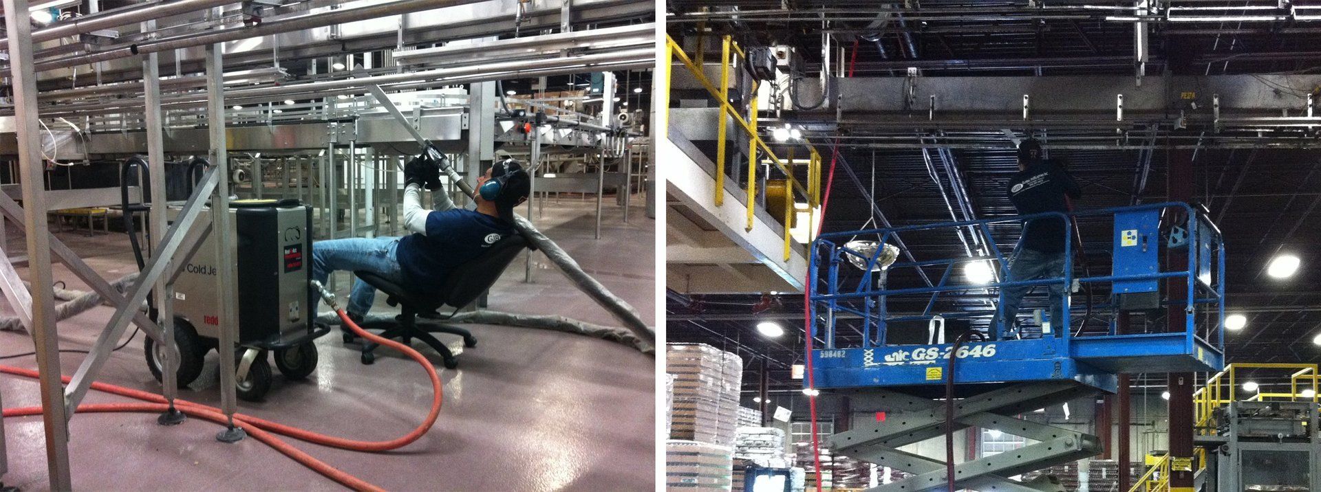 A man is sitting in a chair in a factory next to a crane.