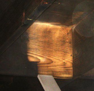 A close up of a piece of wood with a light shining through it