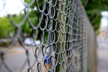 chain link fence beside the road