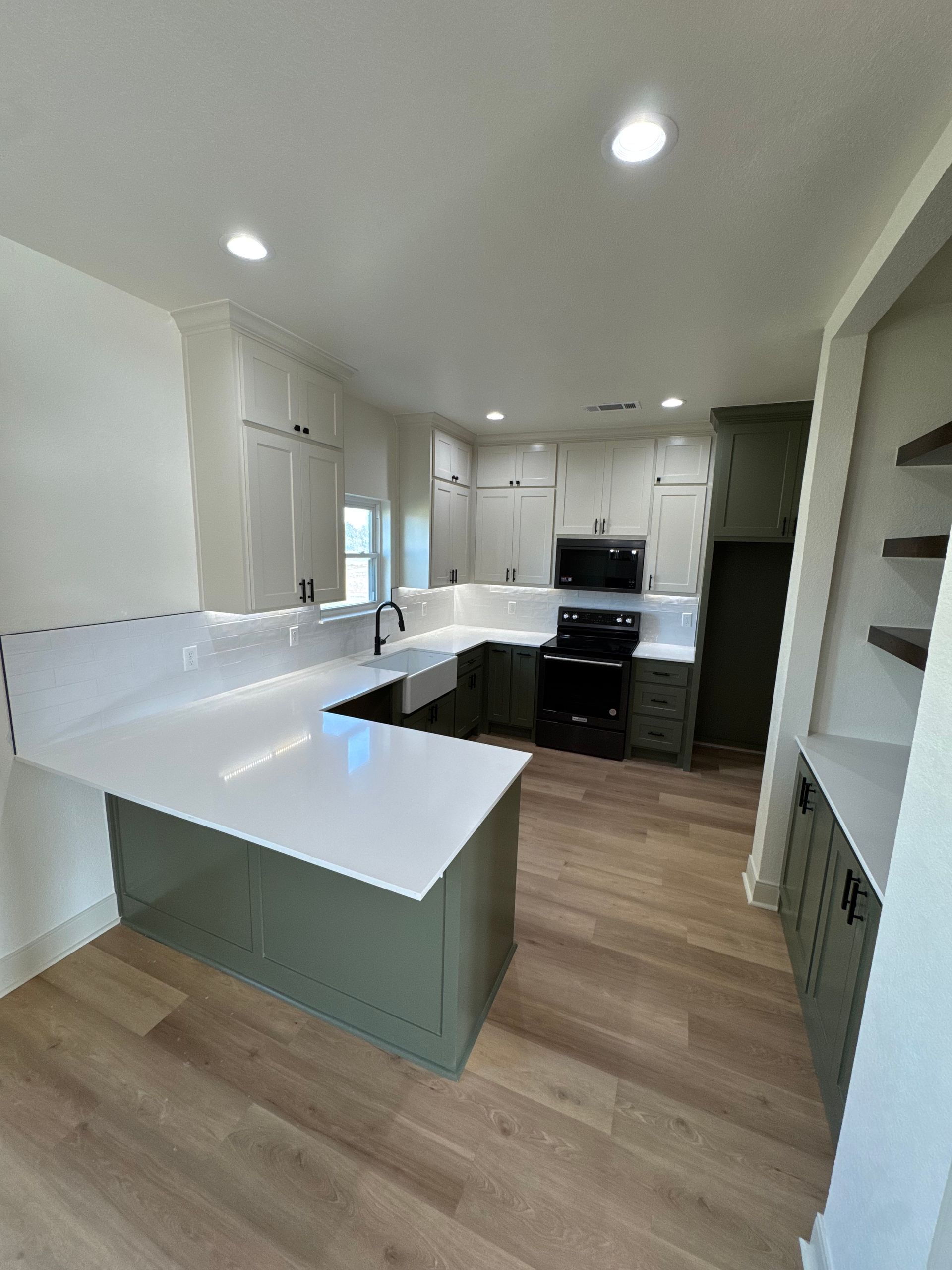A kitchen with a large island in the middle of the room.