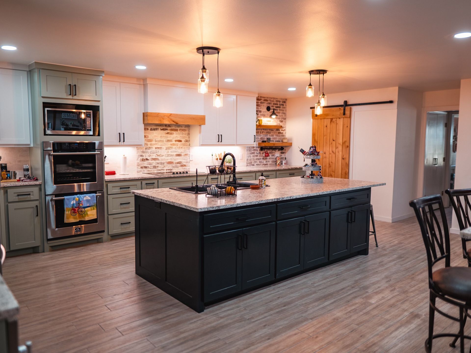 There is a large island in the middle of the kitchen.