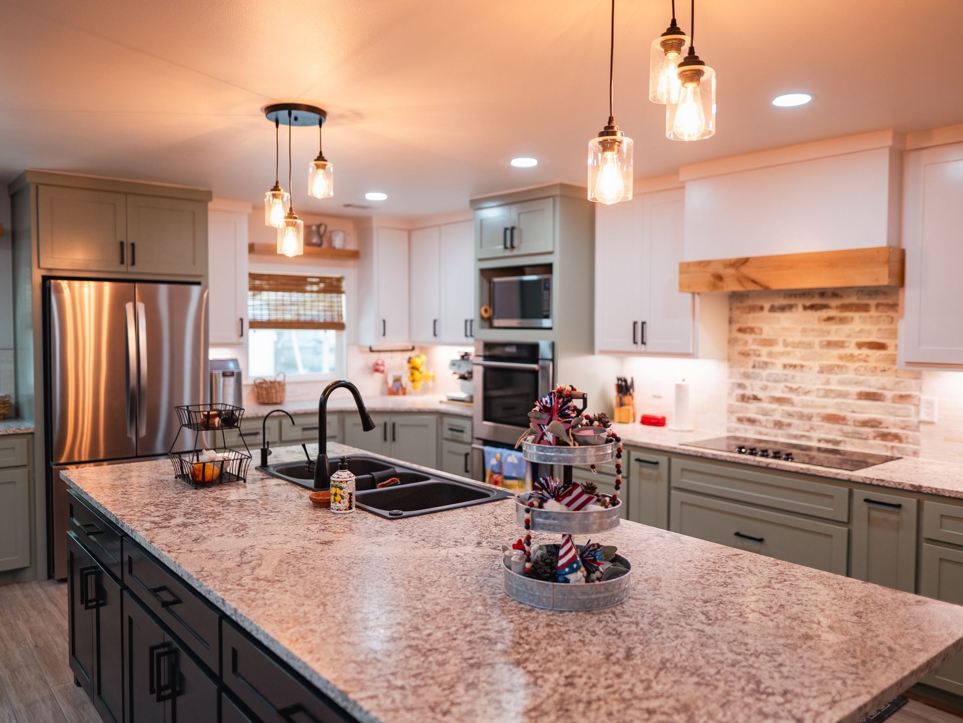 A kitchen with stainless steel appliances and granite counter tops.