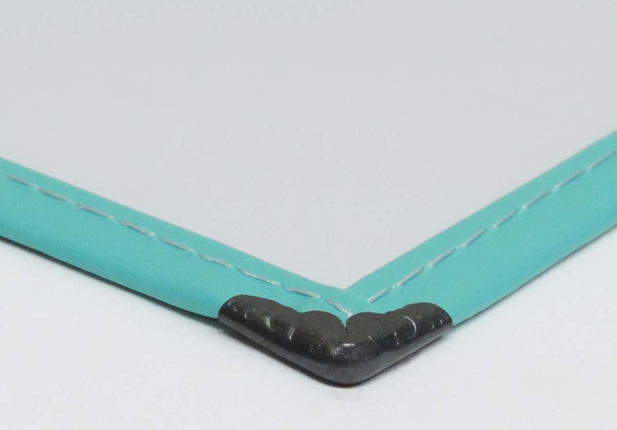 a picture frame with a blue border and a black corner