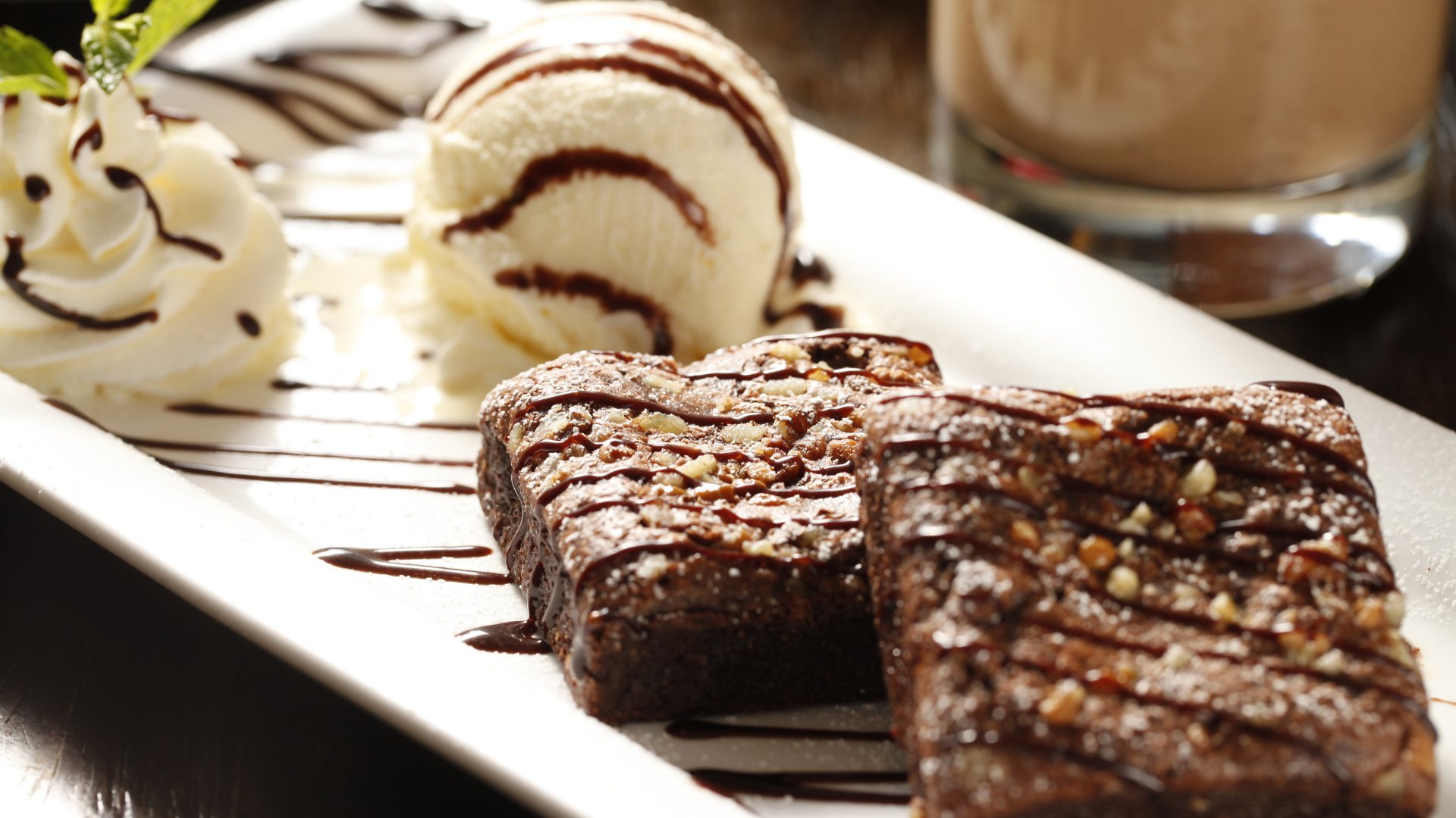 a white plate topped with brownies and ice cream