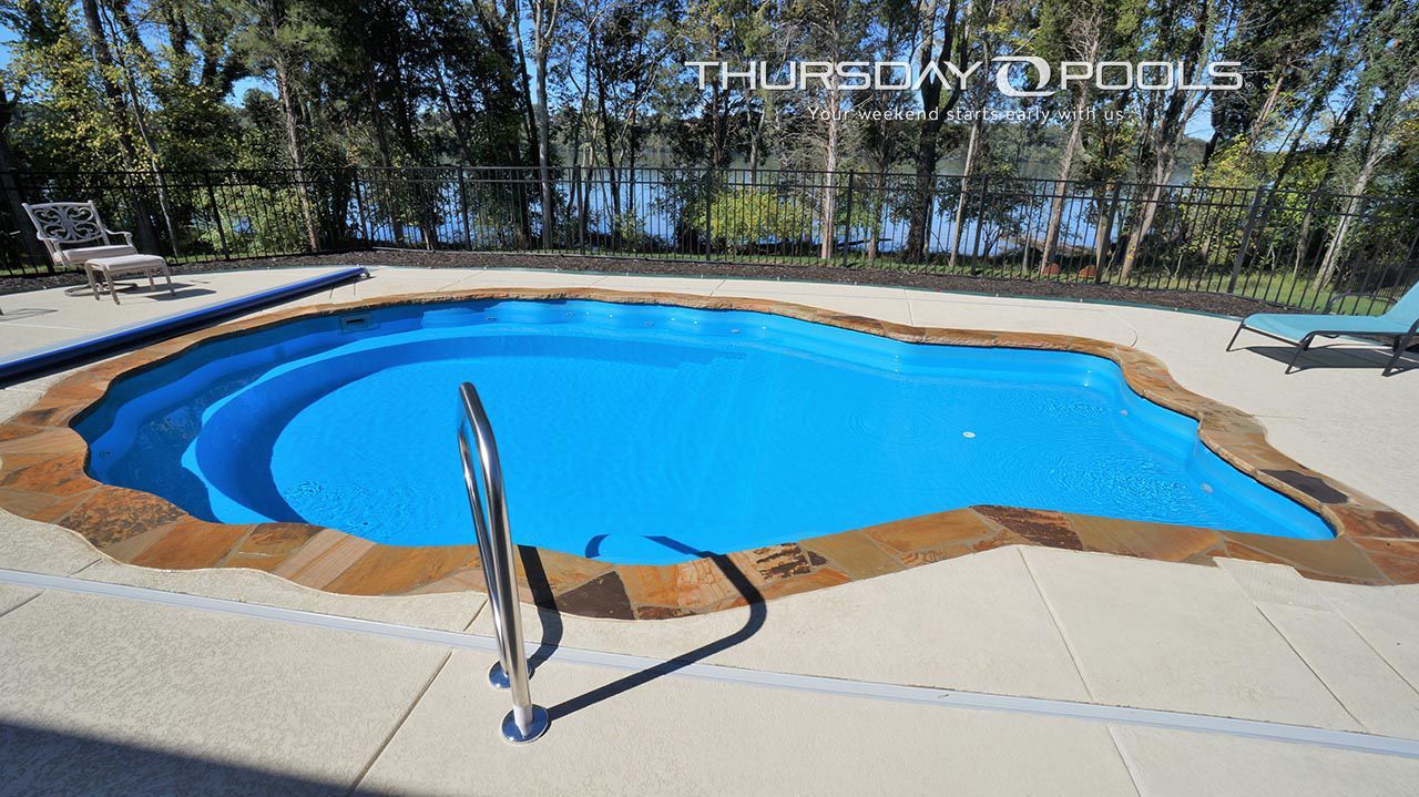 A large swimming pool with the words thursday pools on the bottom