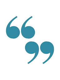 A woman with curly hair is wearing a white sweater and smiling.