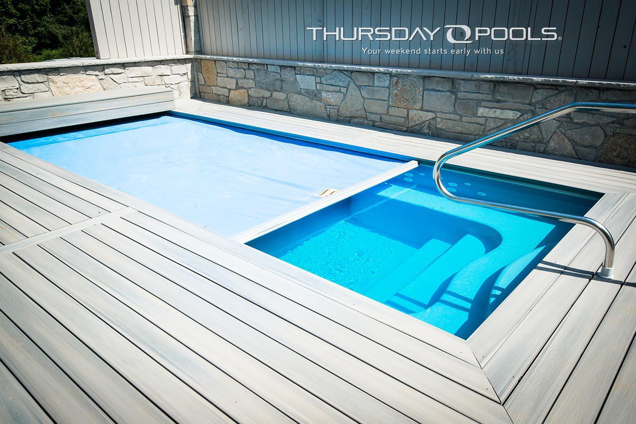A swimming pool with a sign that says thursday pools