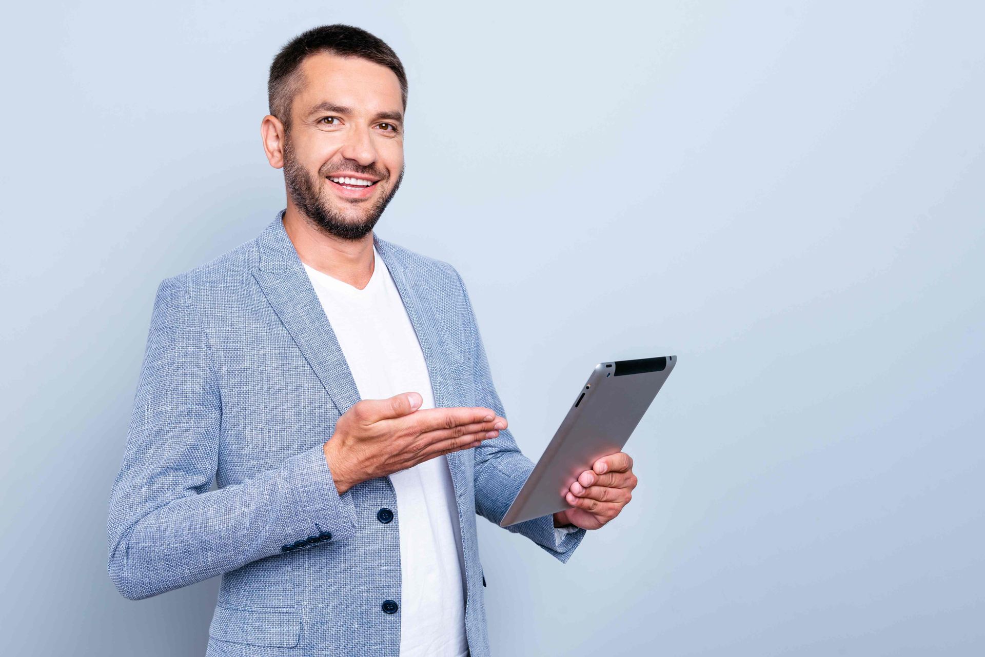 A Lubbock man with electronic tablet product photo shoot