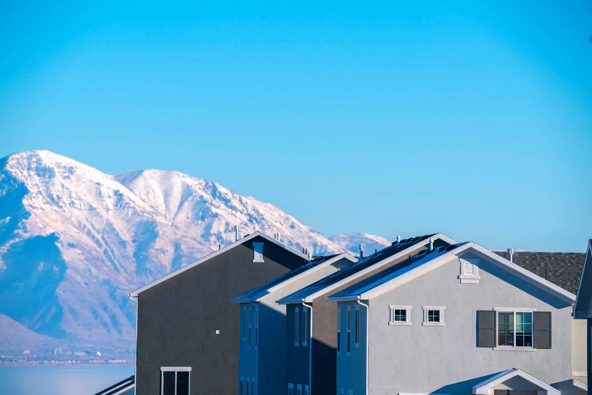 An exterior real estate photo  with mountains in the background