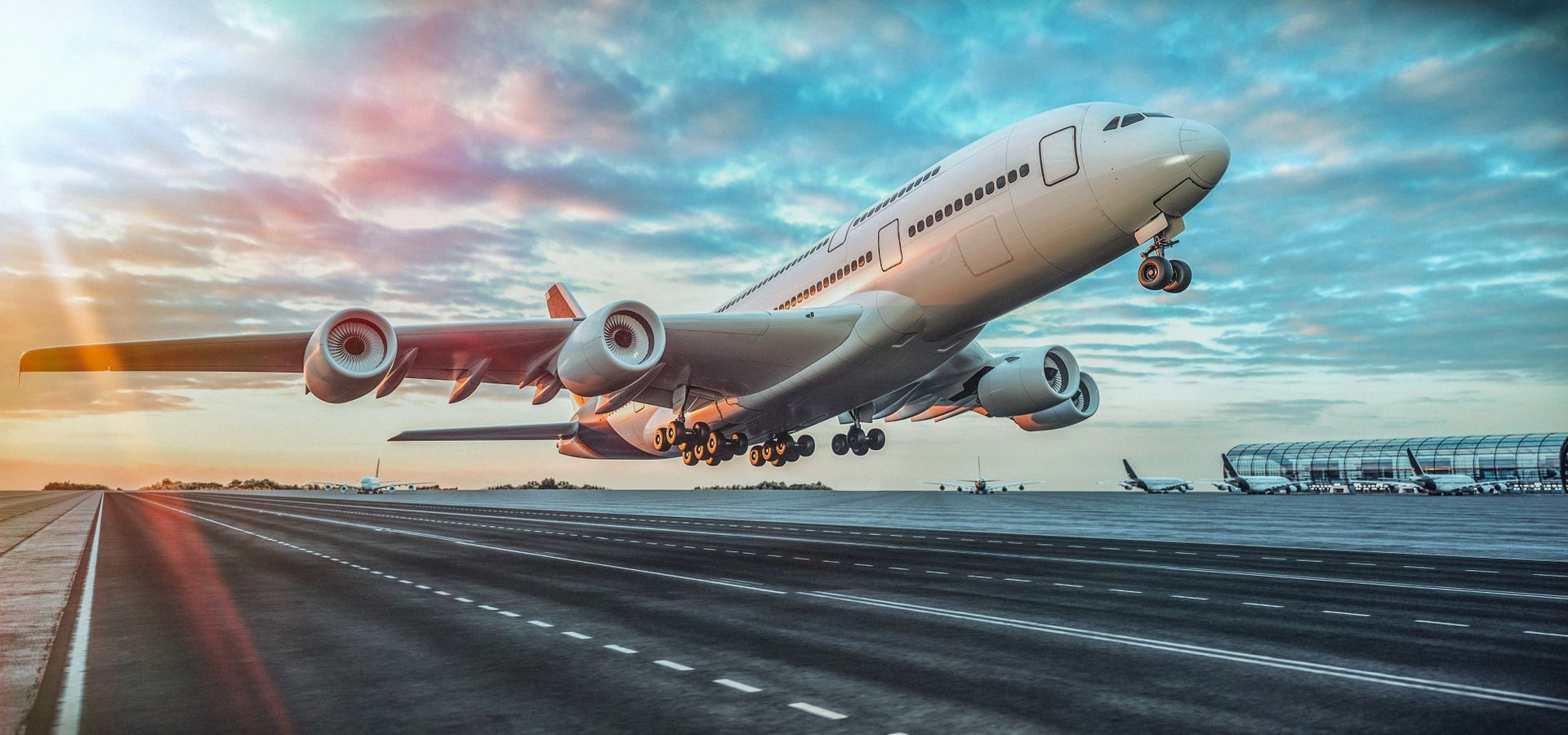 A large passenger jet is taking off from an airport runway.