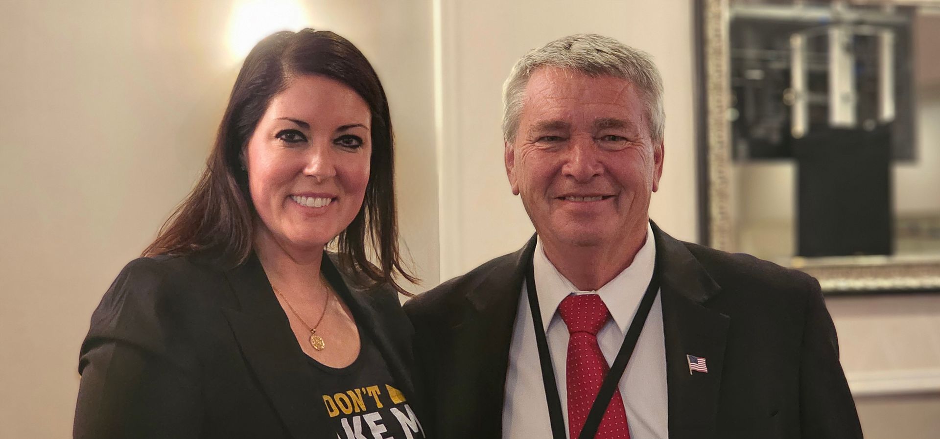 A man and a woman are posing for a picture together.