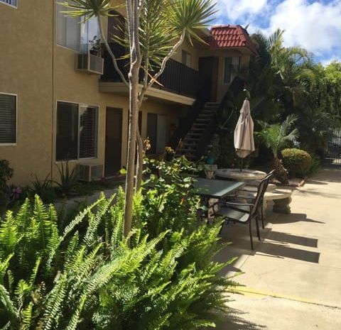 Community patio area next to apartments