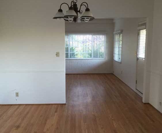 Dining and living area with hardwood floors