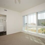 Interior room with generous window space and blinds