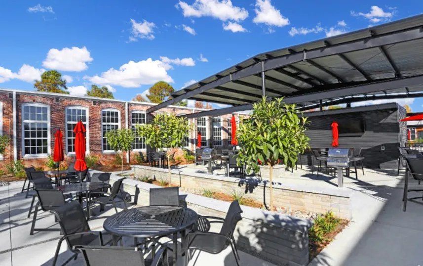Outdoor communal area with seating and umbrellas