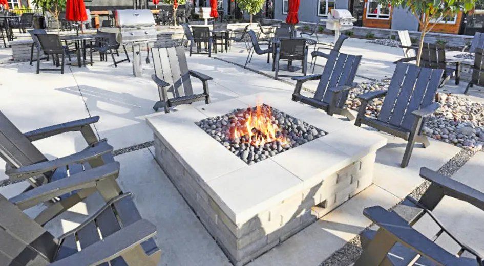 Outdoor communal fire pit surrounded by seating