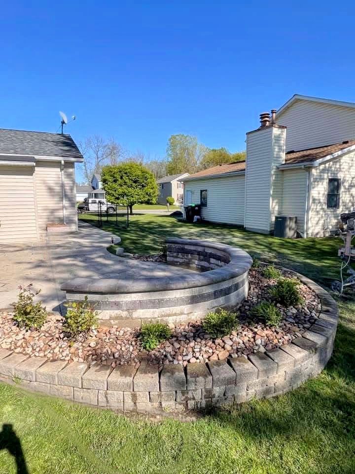 There is a fire pit in the middle of the yard.
