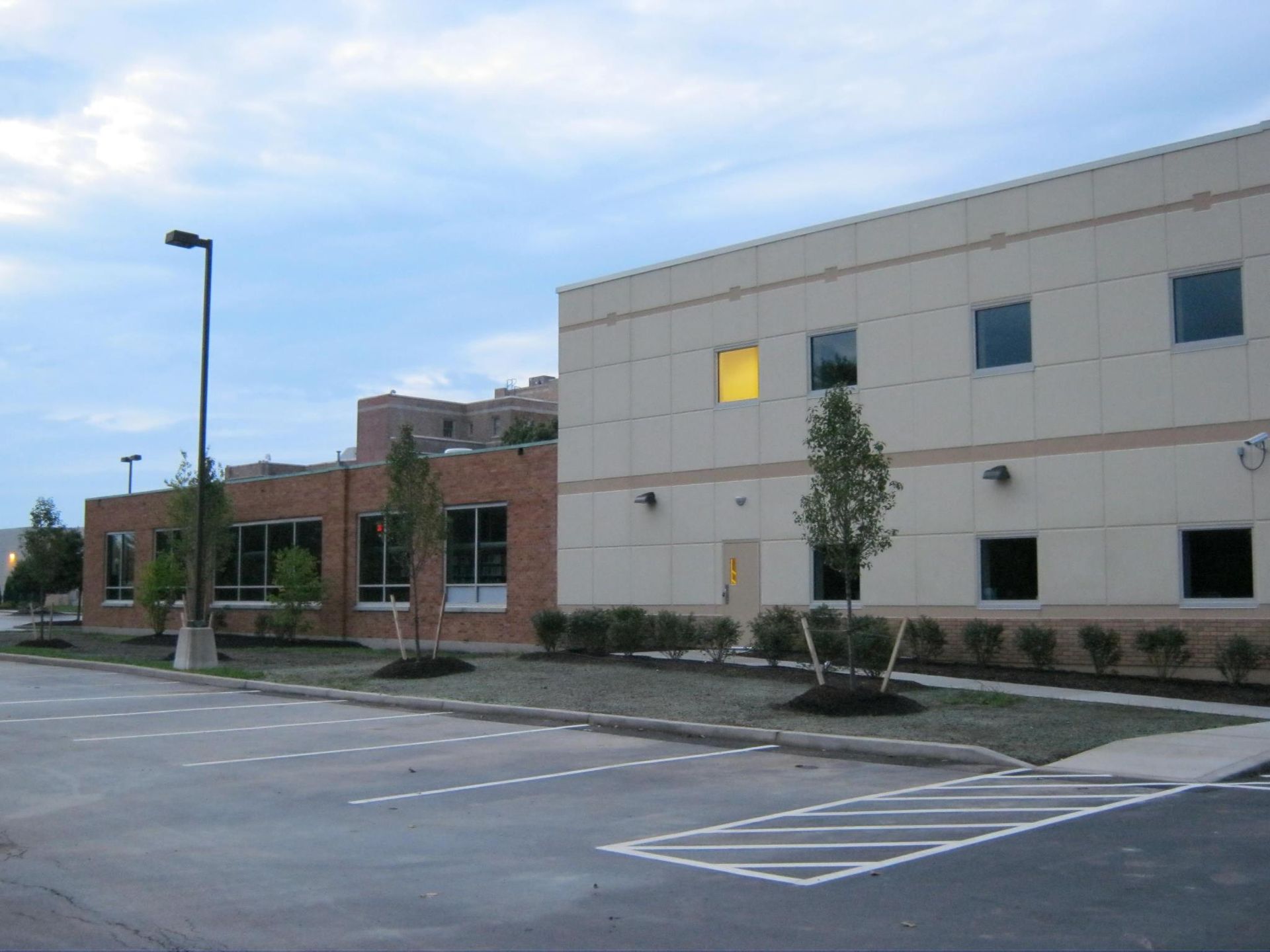 A building with a yellow light on the side of it