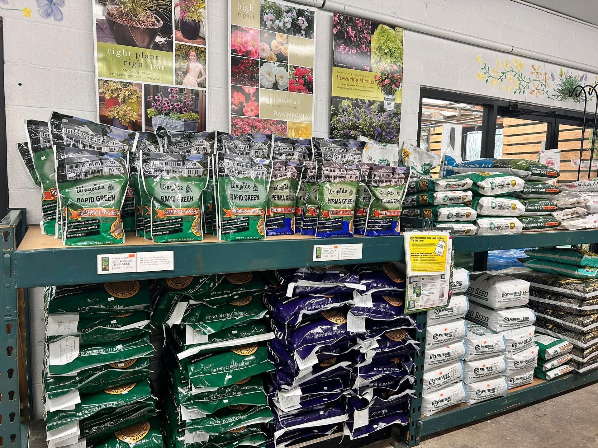 A shelf filled with bags of soil in a store.