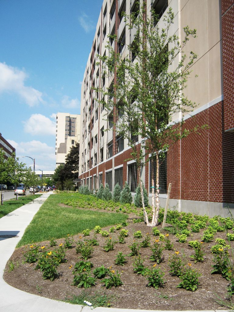 A brick building with a sidewalk leading to it