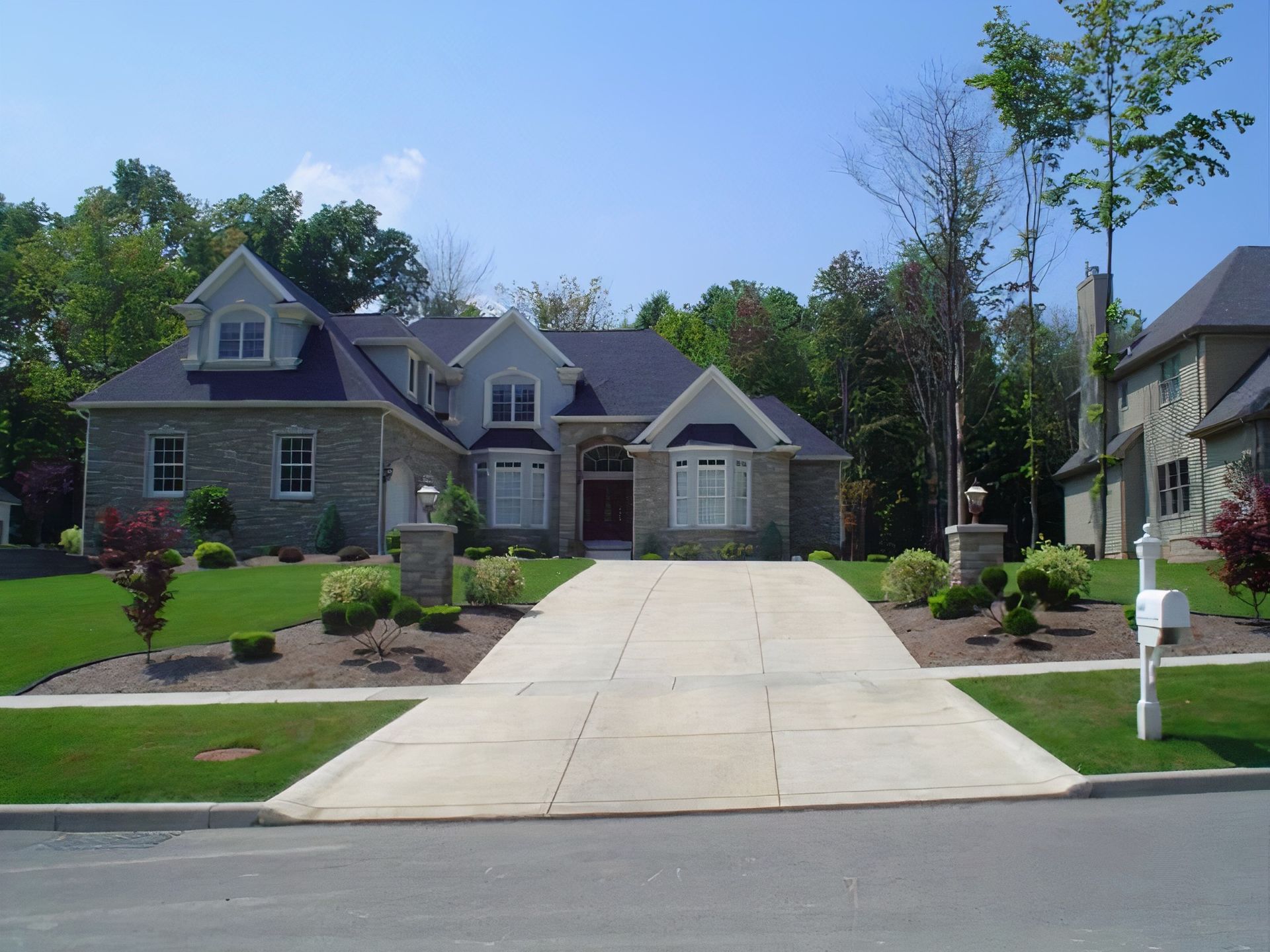 A large house with a driveway leading to it