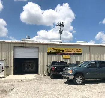 A truck is parked in front of a building.