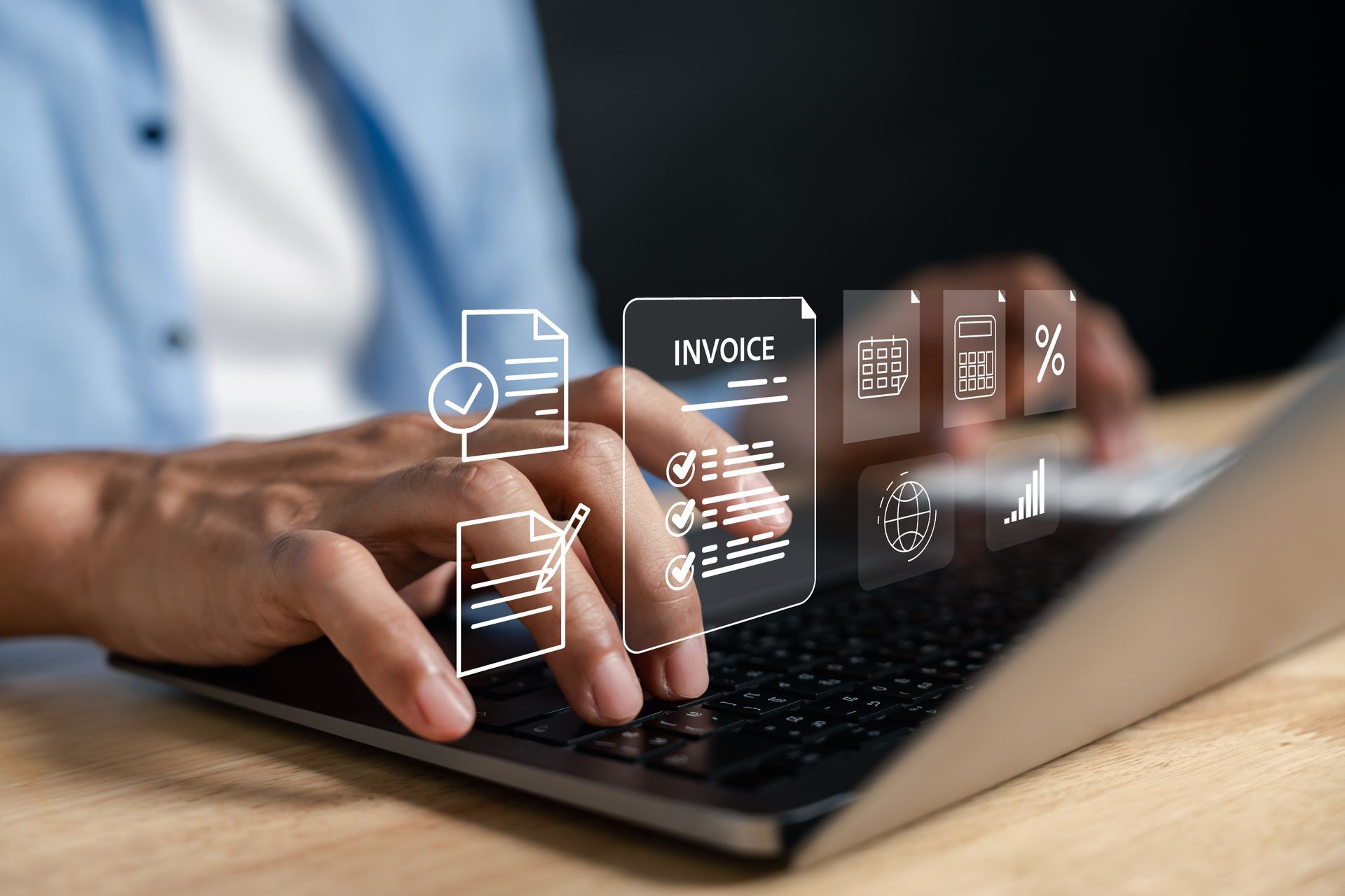 Person using a laptop with digital invoice and document icons overlaid.