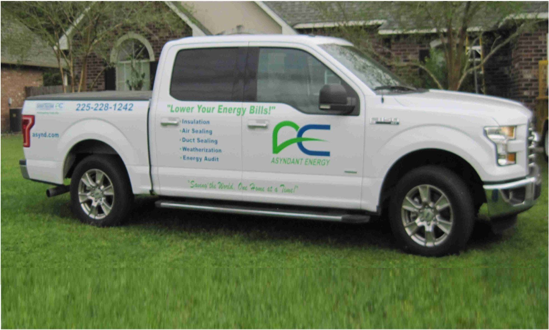 White pickup truck with company logo 