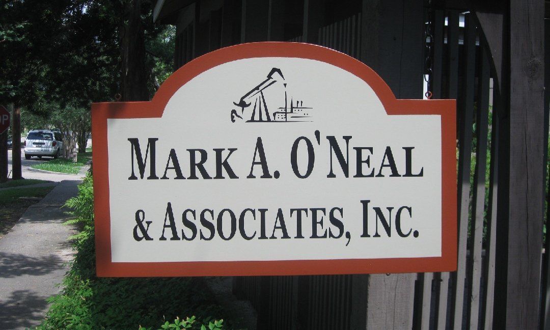 Sign for Mark A. O'Neal & Associates, Inc. with logo, on a brown and white wooden sign, outdoors.