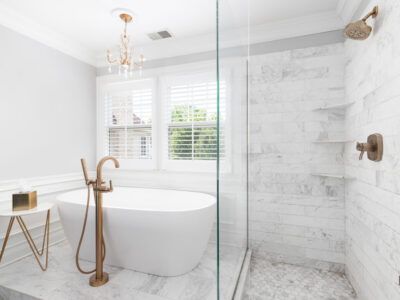 A bathroom with a bathtub and a walk in shower.