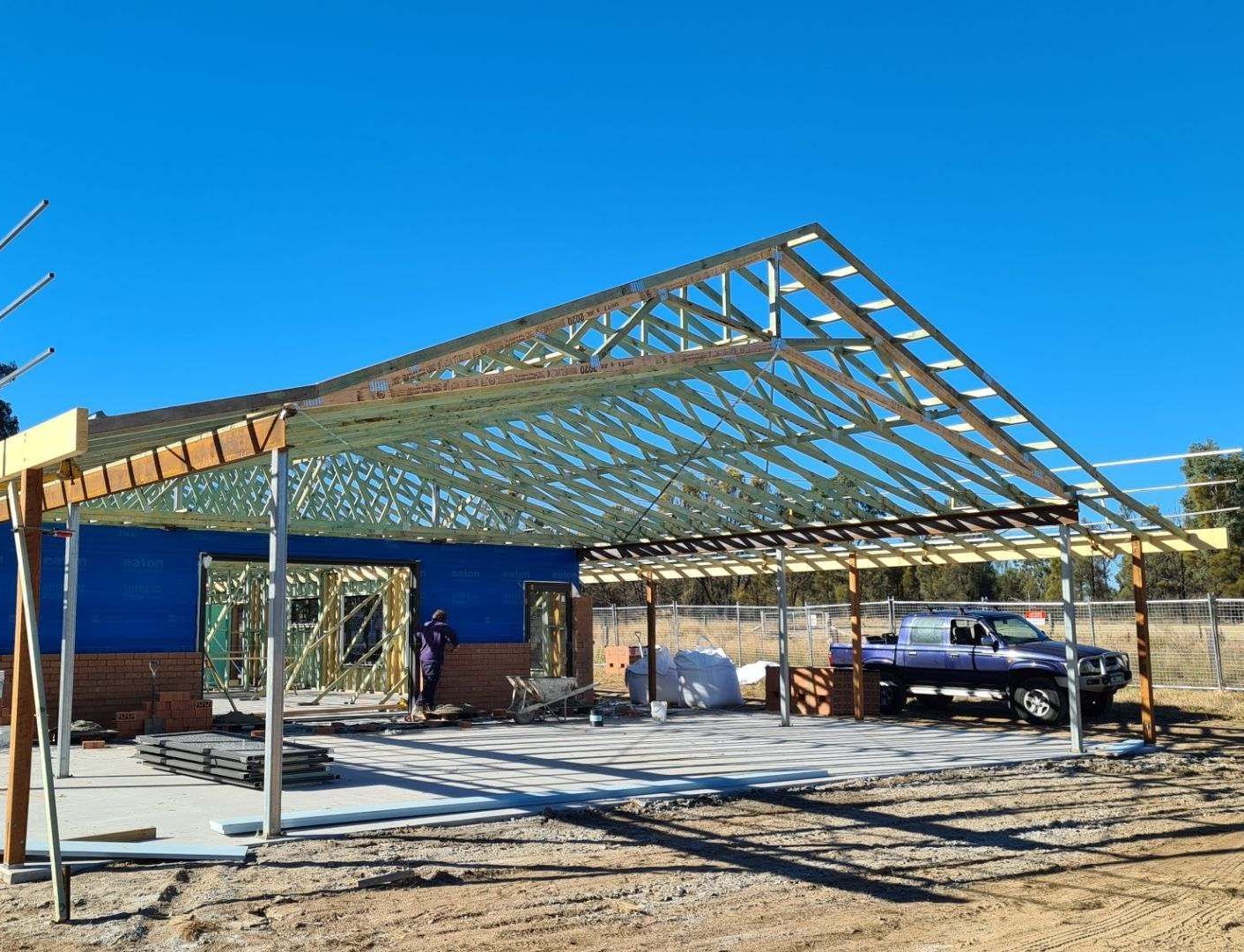 A Close Up of a Wooden Structure With a White Background — Trussted Frames & Trusses In Taminda, NSW
