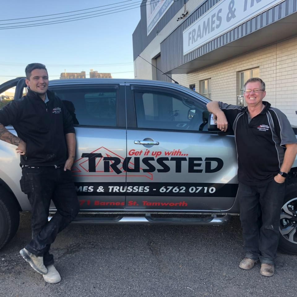 Two men standing next to a truck that says Trussted — Trussted Frames & Trusses In Taminda, NSW