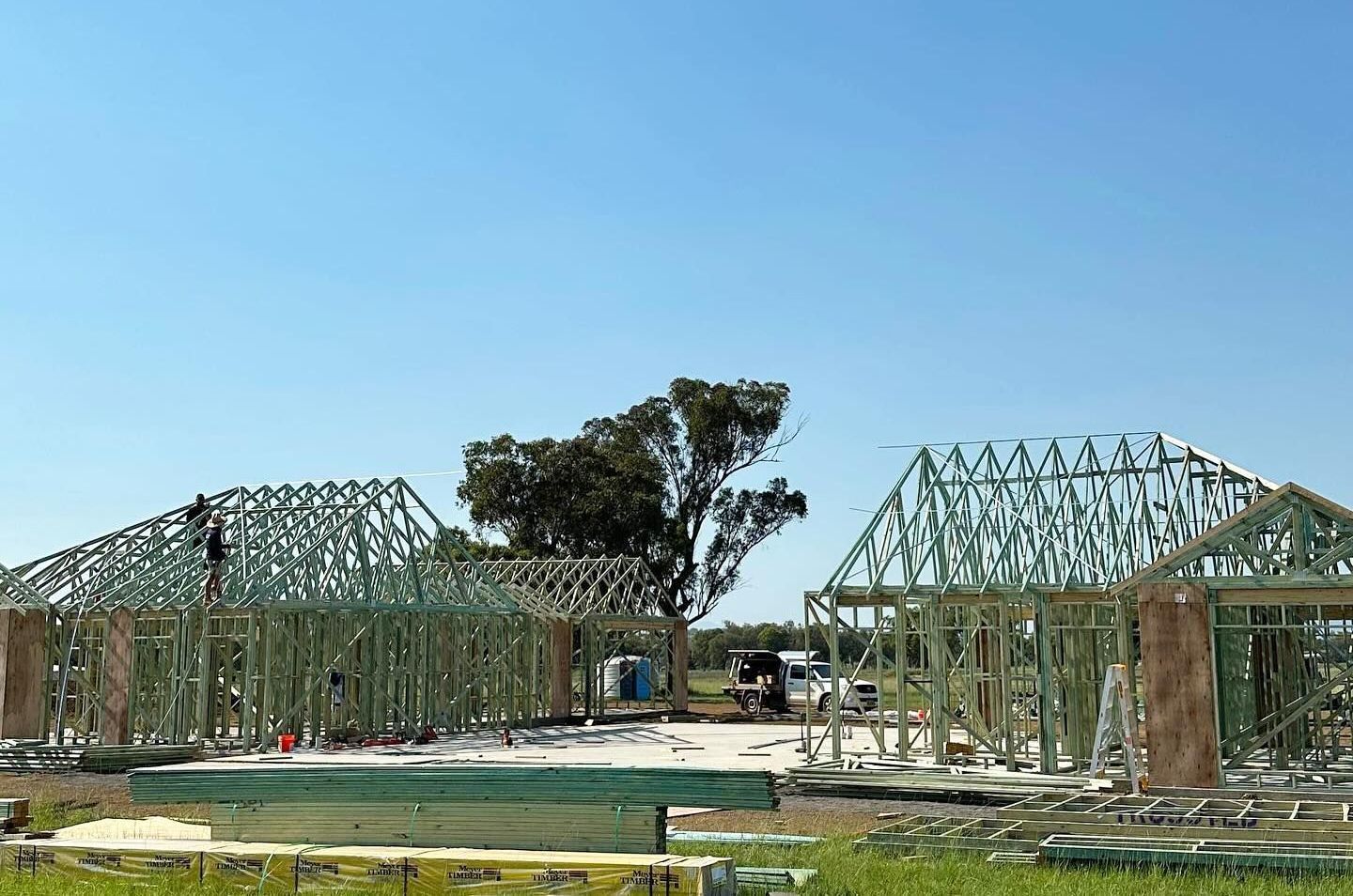 Looking Up at the Roof of a Building Under Construction — Trussted Frames & Trusses In Taminda, NSW