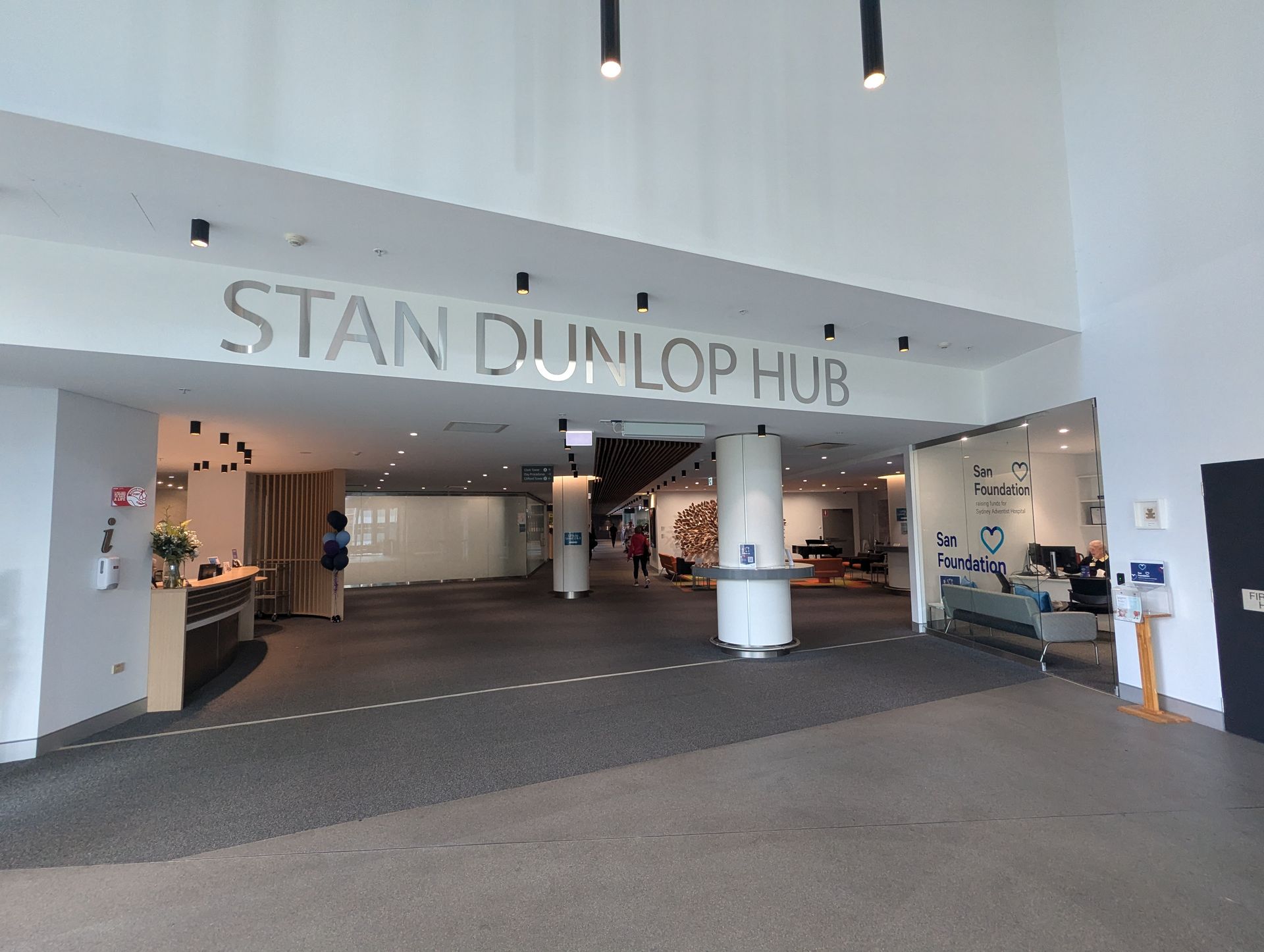 A large lobby with a sign that says stan dunlop hub