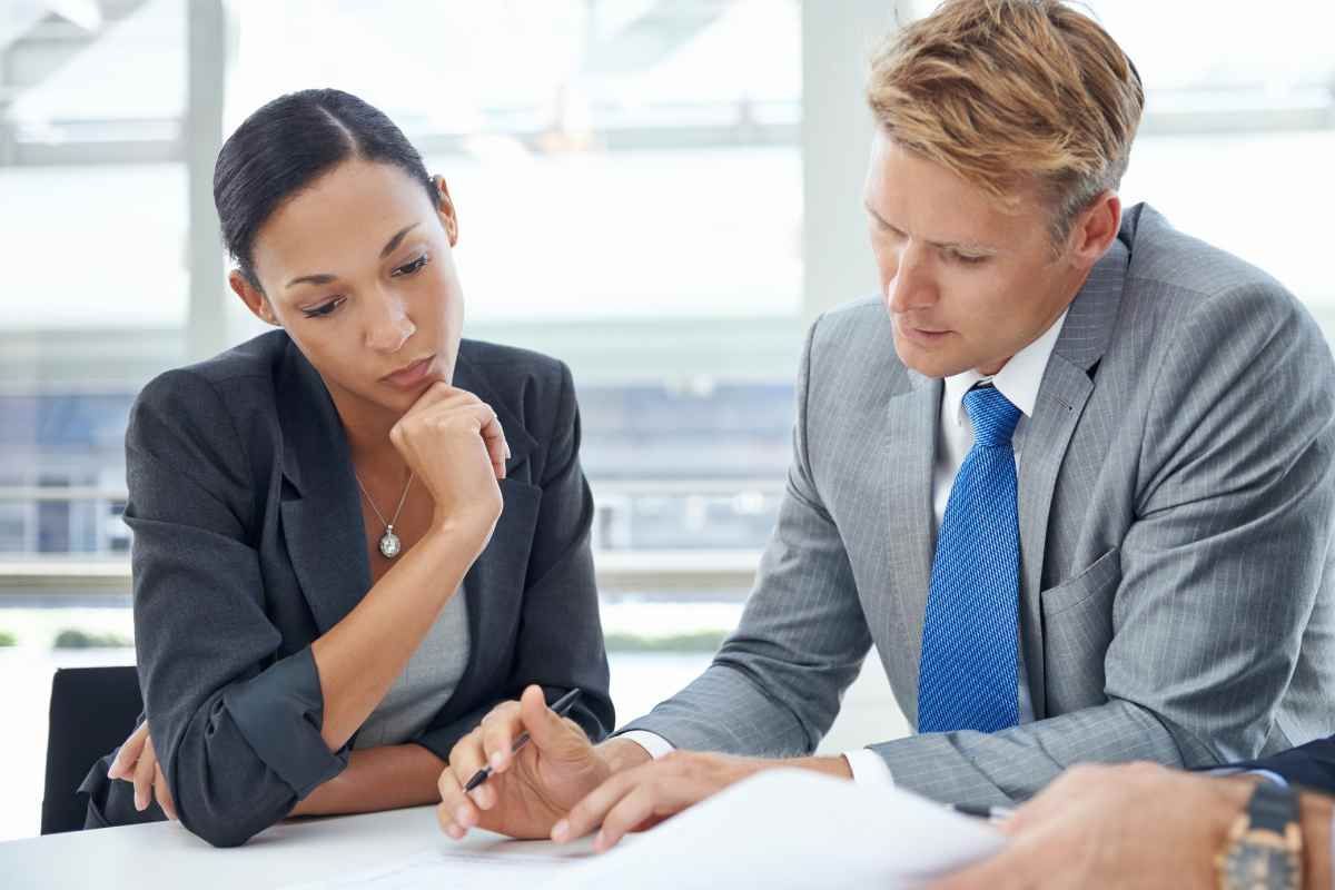 two individuals manage their small business with business insurance 